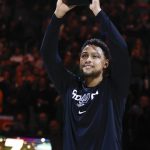
              San Antonio Spurs guard Bryn Forbes (7) reacts after receiving his NBA Championship ring from last season with the Milwaukee Bucks before the first half of an NBA basketball game Saturday, Oct. 30, 2021, in Milwaukee. (AP Photo/Jeffrey Phelps)
            