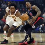 
              Cleveland Cavaliers guard Collin Sexton, left, steals the ball from Los Angeles Clippers guard Eric Bledsoe during the first half of an NBA basketball game Wednesday, Oct. 27, 2021, in Los Angeles. (AP Photo/Marcio Jose Sanchez)
            