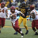 
              Iowa State quarterback Brock Purdy (15) runs with the ball against West Virginia during the second half of an NCAA college football game in Morgantown, W.Va., Saturday, Oct. 30, 2021. (AP Photo/Kathleen Batten)
            