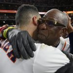
              Houston Astros manager Dusty Baker Jr. and shortstop Carlos Correa celebrate their win against the Boston Red Sox in Game 6 of baseball's American League Championship Series Friday, Oct. 22, 2021, in Houston. The Astros won 5-0, to win the ALCS series in game six. (AP Photo/David J. Phillip)
            