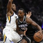 
              Utah Jazz guard Donovan Mitchell, tries to stop the drive of Sacramento Kings forward Harrison Barnes during the first quarter of an NBA basketball game in Sacramento, Calif., Friday, Oct. 22, 2021. (AP Photo/Jose Luis Villegas)
            