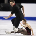 
              Russia's Daria Pavliuchenko and Denis Khodykin perform their pairs short program during the Skate Canada figure skating competition in Vancouver, British Columbia, Friday, Oct. 29, 2021. (Darryl Dyck/The Canadian Press via AP)
            