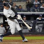 
              New York Yankees' Aaron Judge singles in the sixth inning of a baseball game against the Tampa Bay Rays, Friday, Oct. 1, 2021, in New York. (AP Photo/Mary Altaffer)
            