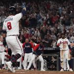 
              Atlanta Braves' Eddie Rosario celebrates after hitting a three run home run during the fourth inning in Game 6 of baseball's National League Championship Series against the Los Angeles Dodgers Saturday, Oct. 23, 2021, in Atlanta. (AP Photo/Ashley Landis)
            