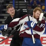 
              Tampa Bay Lightning right wing Corey Perry (10) and Colorado Avalanche left wing J.T. Compher (37) scrap during the second period of an NHL hockey game Saturday, Oct. 23, 2021, in Tampa, Fla. (AP Photo/Chris O'Meara)
            