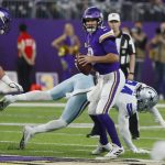 
              Minnesota Vikings quarterback Kirk Cousins (8) throws a pass ahead of Dallas Cowboys defensive end Randy Gregory, rear, during the first half of an NFL football game, Sunday, Oct. 31, 2021, in Minneapolis. (AP Photo/Bruce Kluckhohn)
            