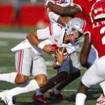 
              Ohio State quarterback C.J. Stroud (7) rushes against Rutgers defensive back Avery Young (2) during an NCAA college football game, Saturday, Oct. 2, 2021, in Piscataway, N.J (AP Photo/Noah K. Murray)
            