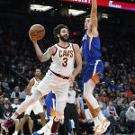 
              Cleveland Cavaliers guard Ricky Rubio (3) looks to pass the ball as Phoenix Suns guard Devin Booker defends during the first half of an NBA basketball game Saturday, Oct. 30, 2021, in Phoenix. (AP Photo/Ross D. Franklin)
            