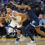 
              Golden State Warriors guard Stephen Curry, left, drives against Memphis Grizzlies guard De'Anthony Melton during the first half of an NBA basketball game in San Francisco, Thursday, Oct. 28, 2021. (AP Photo/Jeff Chiu)
            