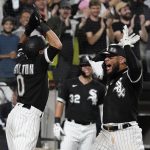 
              Chicago White Sox's Yoan Moncada, right, celebrates with Billy Hamilton after hitting a two-run home run during the eighth inning of a baseball game against the Detroit Tigers in Chicago, Saturday, Oct. 2, 2021. (AP Photo/Nam Y. Huh)
            
