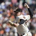 
              San Francisco Giants starting pitcher Logan Webb works against the San Diego Padres in the first inning of a baseball game in San Francisco, Sunday, Oct. 3, 2021. (AP Photo/John Hefti)
            