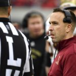 
              Boston College head coach Jeff Hafley discusses a call with a game official during the first half of an NCAA college football game against Louisville in Louisville, Ky., Saturday, Oct. 23, 2021. (AP Photo/Timothy D. Easley)
            