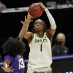 
              FILE - Baylor forward NaLyssa Smith (1) shoots over TCU guard Tavy Diggs (13) during the first half of an NCAA college basketball game in the quarterfinal round of the Big 12 Conference tournament in Kansas City, Mo., in this Friday, March 12, 2021, file photo. Smith was named to the preseason Associated Press NCAA college basketball All-America team on Tuesday, Oct. 26, 2021. (AP Photo/Orlin Wagner, File)
            