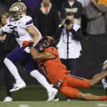 
              Washington running back Sean McGrew (5) sheds Oregon State defensive back Alton Julian (7) on a 39-yard rush to score a touchdown during the second half of an NCAA college football game Saturday, Oct. 2, 2021, in Corvallis, Ore. Oregon State won 27-24. (AP Photo/Amanda Loman)
            