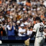
              San Francisco Giants starting pitcher Logan Webb acknowledges the fans as he leaves the field in the eighth inning of a baseball game against the San Diego Padres in San Francisco, Sunday, Oct. 3, 2021. (AP Photo/John Hefti)
            