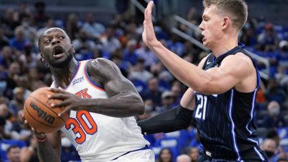 New York Knicks' Julius Randle (30) looks for a way past Orlando Magic's Moritz Wagner during the f...
