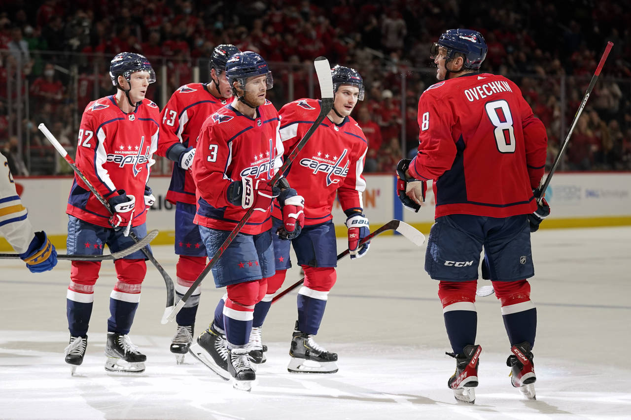 Washington Capitals left wing Alex Ovechkin (8) celebrates his goal with teammates in the second pe...