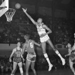 
              FILE - Wilt Chamberlain, of Philadelphia, shoots in an NBA playoff game against the Boston Celtics, March 19, 1960. The 1960s was the decade Chamberlain scored 100 points, the Celtics-Lakers rivalry took flight and the NBA's second dynasty reigned on the Boston Garden's parquet court. (AP Photo/Sam Myers, File)
            