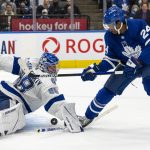 
              Tampa Bay Lightning goaltender Andrei Vasilevskiy (88) makes a save against Toronto Maple Leafs' Wayne Simmonds (24) during second-period NHL hockey game action in Toronto, Thursday, Nov. 4, 2021. (Frank Gunn/The Canadian Press via AP)
            