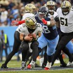 
              New Orleans Saints quarterback Trevor Siemian (15) is sacked by Tennessee Titans defensive tackle Jeffery Simmons (98) in the first half of an NFL football game Sunday, Nov. 14, 2021, in Nashville, Tenn. (AP Photo/John Amis)
            