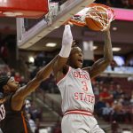 
              Ohio State's Eugene Brown, right, dunks as Bowling Green's Cam Young defends during the second half of an NCAA college basketball game Monday, Nov. 15, 2021, in Columbus, Ohio. (AP Photo/Jay LaPrete)
            