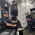 
              Seven-time NASCAR champion Jimmie Johnson stands in the doorway of the team hauler at Road Atlanta Raceway in Braselton, Georgia, Friday, Nov. 12, 2021, talking with Chad Knaus, right, his former crew chief, and Gary Nelson, team manager of the IMSA sports car Action Express Racing team. Johnson and Knaus have long had an on-and-off relationship that ended in 2019 after 17 seasons together. The two have been reunited by work four times this season as Knaus has run a sports car team that Johnson and Hendrick Motorsports put together in partnership with Action Express for four IMSA endurance sports car races this year. Both say their relationship is currently in a good place. (AP Photo/Jenna Fryer)
            