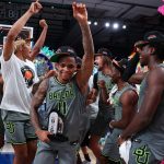 
              In this photo provided by Bahamas Visual Services, Baylor guard James Akinjo (11), the tournament's MVP, celebrates with teammates after defeating Michigan State in an NCAA college basketball game at Paradise Island, Bahamas, Friday, Nov. 26, 2021. (Tim Aylen/Bahamas Visual Services via AP)
            