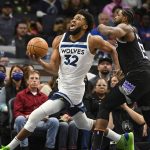 
              Minnesota Timberwolves center Karl-Anthony Towns (32) drives to the basket past Sacramento Kings center Tristan Thompson during the second half of an NBA basketball game Wednesday, Nov. 17, 2021, in Minneapolis. (AP Photo/Craig Lassig)
            