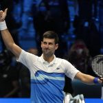 
              Serbia's Novak Djokovic celebrates after defeating Norways' Casper Ruud during their ATP World Tour Finals singles tennis match, at the Pala Alpitour in Turin, Monday, Nov. 15, 2021. (AP Photo/Luca Bruno)
            