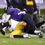 
              Iowa defensive back Dane Belton, left, is tackled by Northwestern wide receiver Stephon Robinson Jr., after he intercepted a pass during the first half of an NCAA college football game in Evanston, Ill., Saturday, Nov. 6, 2021. (AP Photo/Nam Y. Huh)
            