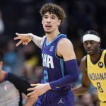
              Charlotte Hornets guard LaMelo Ball (2) reacts after making a 3-point basket against the Indiana Pacers during the first half of an NBA basketball game in Charlotte, N.C., Friday, Nov. 19, 2021. (AP Photo/Jacob Kupferman)
            