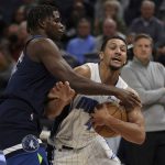 
              Orlando Magic's Jalen Suggs (4) tries to maintain control of the ball against Minnesota Timberwolves' Anthony Edwards (1) during the first half of an NBA basketball game Monday, Nov. 1, 2021, in Minneapolis. (AP Photo/Stacy Bengs)
            