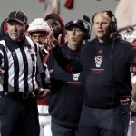 
              North Carolina State coach Dave Doeren, right, questions an official's call during the first half of the team's NCAA college football game against North Carolina on Friday, Nov. 26, 2021, in Raleigh, N.C. (AP Photo/Chris Seward)
            