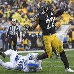 
              Pittsburgh Steelers running back Najee Harris (22) slips a tackle attempted by Detroit Lions cornerback Jerry Jacobs (39) during the second half of an NFL football game in Pittsburgh, Sunday, Nov. 14, 2021. (AP Photo/Don Wright)
            