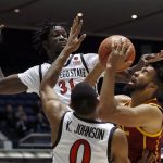 
              Southern California forward Isaiah Mobley, right, shoots against San Diego State forwards Nathan Mensah, top left, and Keshad Johnson during the first half of an NCAA college basketball game at the Wooden Legacy tournament in Anaheim, Calif., Friday, Nov. 26, 2021. (AP Photo/Alex Gallardo)
            