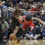 
              Chicago Bulls guard Lonzo Ball (2) gains control of the ball in front of Orlando Magic guard Terrence Ross (31) during the first half of an NBA basketball game, Friday, Nov. 26, 2021, in Orlando, Fla. (AP Photo/Phelan M. Ebenhack)
            