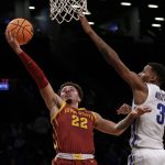 
              Iowa State's Gabe Kalscheur (22) drives to the basket past Memphis' Landers Nolley II (3) during the first half of an NCAA college basketball game in the NIT Season Tip-Off tournament Friday, Nov. 26, 2021, in New York. (AP Photo/Adam Hunger)
            