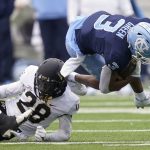 
              Wake Forest defensive back Zion Keith (28) tackles North Carolina wide receiver Antoine Green (3) during the first half of an NCAA college football game in Chapel Hill, N.C., Saturday, Nov. 6, 2021. (AP Photo/Gerry Broome)
            