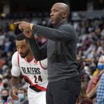 
              Portland Trail Blazers head coach Chauncey Billups, front, directs forward Norman Powell in the first half of an NBA basketball game against the Denver Nuggets, Sunday, Nov. 14, 2021, in Denver. (AP Photo/David Zalubowski)
            