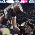 
              Purdue players lift the Old Oaken Bucket after they defeated Indiana 44-7 in an NCAA college football game, Saturday, Nov. 27, 2021, in West Lafayette, Ind.(AP Photo/Darron Cummings)
            