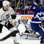 
              Los Angeles Kings goaltender Jonathan Quick (32) makes a save as teammate Olli Maatta (6) and Toronto Maple Leafs center David Kampf (64) look on during second-period NHL hockey game action in Toronto, Monday, Nov. 8, 2021. (Frank Gunn/The Canadian Press via AP)
            