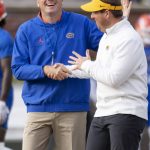 
              Florida coach Dan Mullen, left, greets Missouri coach Eliah Drinkwitz before an NCAA college football game Saturday, Nov. 20, 2021, in Columbia, Mo. (AP Photo/L.G. Patterson)
            
