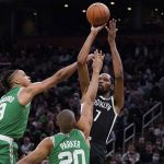 
              Brooklyn Nets forward Kevin Durant (7) shoots while covered by Boston Celtics guard Romeo Langford (9) and forward Jabari Parker (20) during the second half of an NBA basketball game, Wednesday, Nov. 24, 2021, in Boston. (AP Photo/Charles Krupa)
            