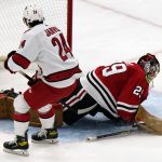 
              Carolina Hurricanes center Seth Jarvis, left, scores against Chicago Blackhawks goaltender Marc-Andre Fleury during the second period of an NHL hockey game in Chicago, Wednesday, Nov. 3, 2021. (AP Photo/Nam Y. Huh)
            