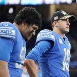 
              Detroit Lions offensive tackle Penei Sewell, left, and quarterback Jared Goff are sen in the bench area during the second half of an NFL football game against the Philadelphia Eagles, Sunday, Oct. 31, 2021, in Detroit. (AP Photo/Paul Sancya)
            