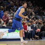 
              Dallas Mavericks guard Luka Doncic celebrates sinking a three-point basket in the first half of an NBA basketball game against the Cleveland Cavaliers in Dallas, Monday, Nov. 29, 2021. (AP Photo/Tony Gutierrez)
            