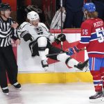 
              Montreal Canadiens' Michael Pezzetta checks Los Angeles Kings' Brendan Lemieux into the boards during the third period of an NHL hockey game Tuesday, Nov. 9, 2021, in Montreal. (Paul Chiasson/The Canadian Press via AP)
            