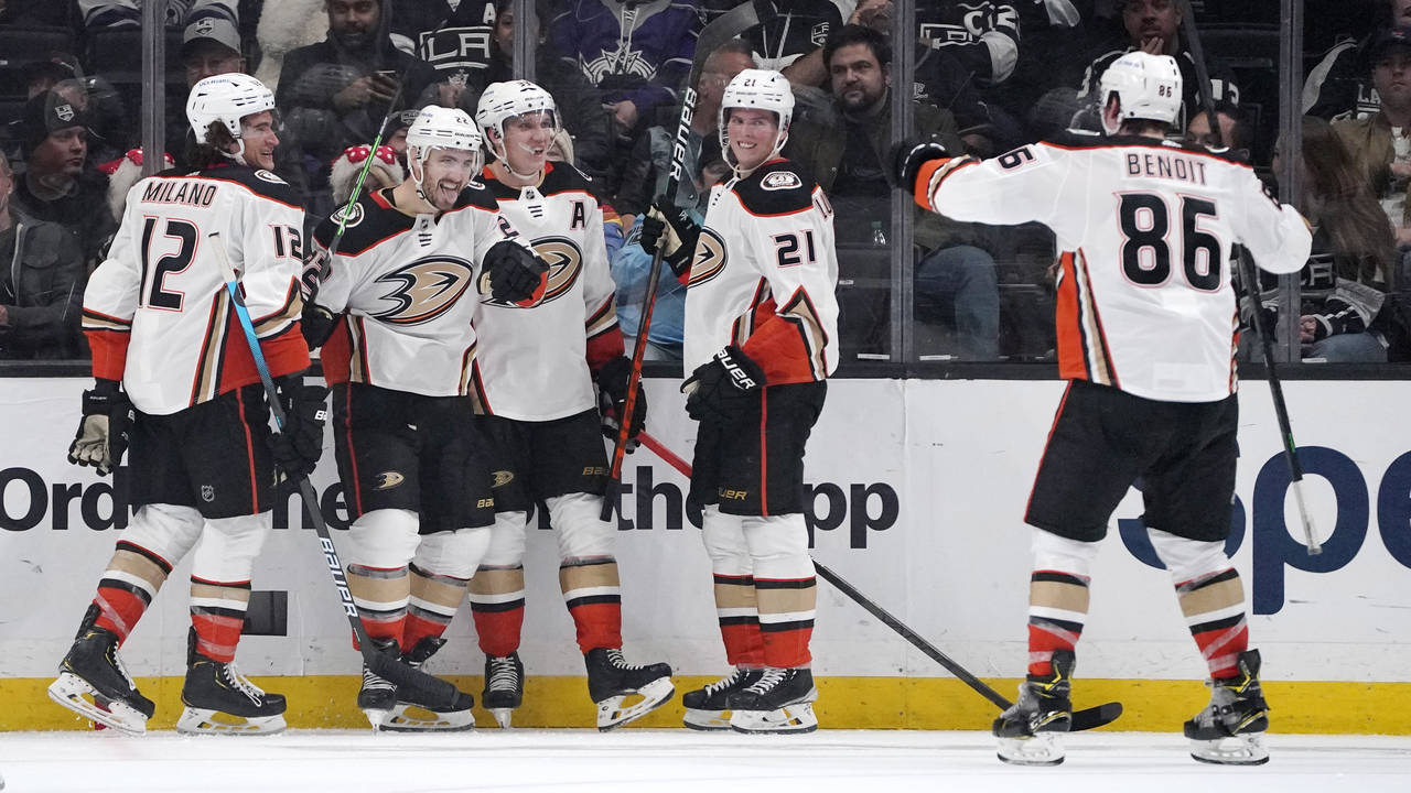 Anaheim Ducks defenseman Kevin Shattenkirk, second from left, celebrates his goal with teammates le...