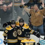 
              Boston Bruins center Patrice Bergeron (37) is congratulated for his goal during the second period of the team's NHL hockey game against the Detroit Red Wings, Thursday, Nov. 4, 2021, in Boston. (AP Photo/Charles Krupa)
            