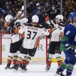 
              Anaheim Ducks' Troy Terry, Ryan Getzlaf, Mason McTavish and Jamie Drysdale, from left, celebrate Terry's overtime goal against the Vancouver Canucks in an NHL hockey game Tuesday, Nov. 9, 2021, in Vancouver, British Columbia. (Darryl Dyck/The Canadian Press via AP)
            